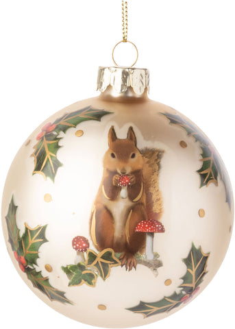 Glass ball ornament with squirrel, holly and toadstool motif